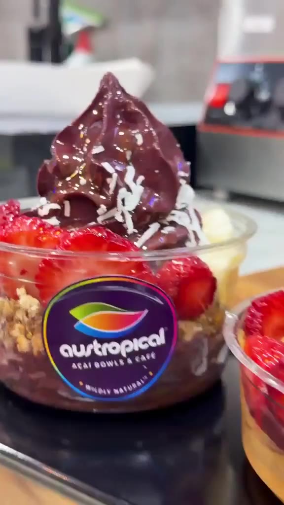 Finished açaí bowls with fruit and sauces on the Sydney café counter.