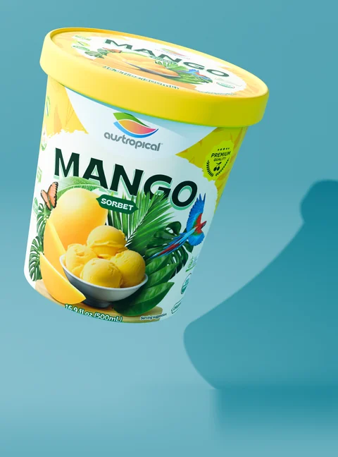 Austropical Organic Mango closed pint with its lid visible, on a colored background with a curved shadow