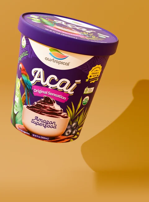 Austropical Organic Açaí Original Sensation closed pint with its lid visible, on a colored background with a curved shadow