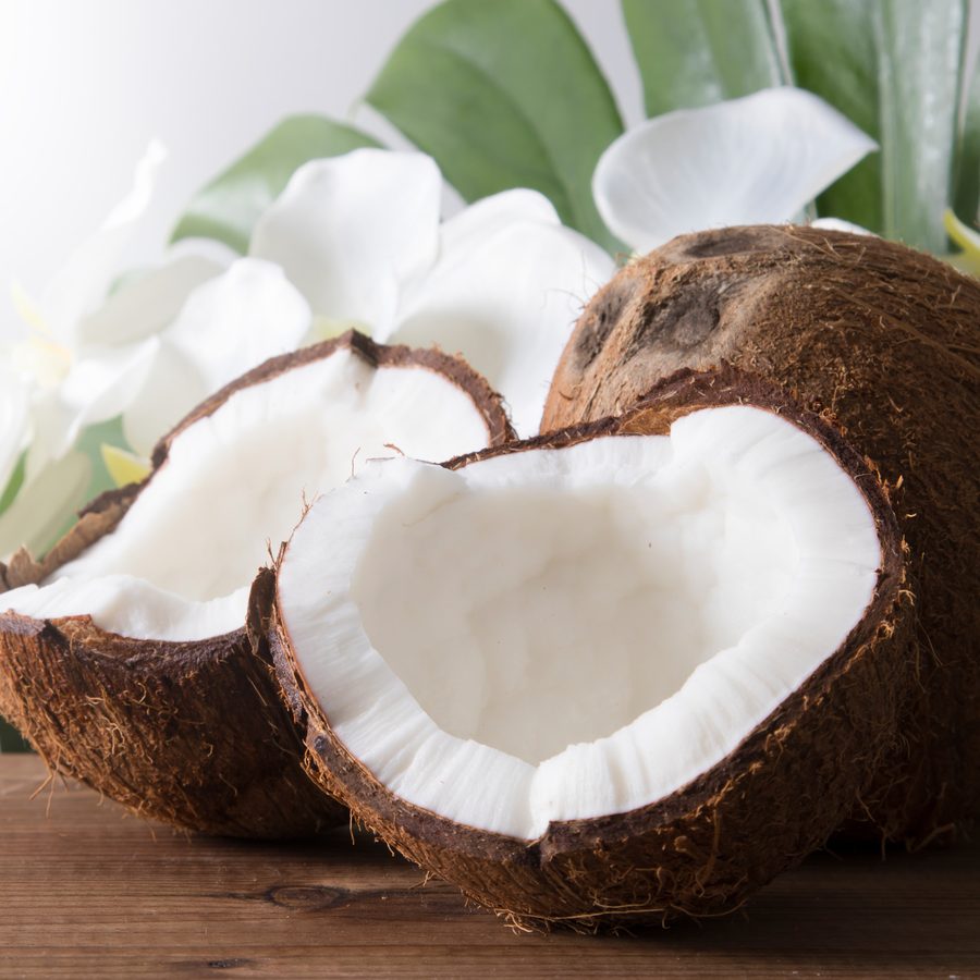 Fresh coconuts, split open to the white flesh